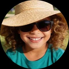 A child in a big sun hat and dark sunglasses